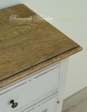 Kitchen or living room cupboard in solid wood with very antique white finish and solid oak top